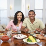 Family Having A Meal Together At Home Family Having A Meal Together At Home